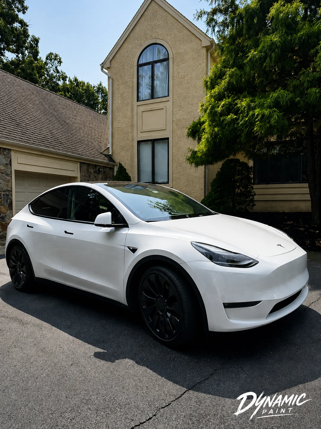 White Tesla Model Y with black wheels