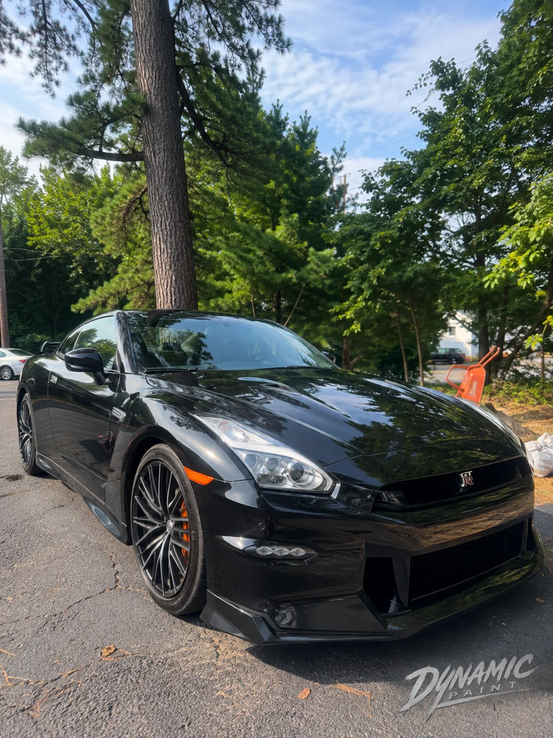 Black Nissan GT-R with dark multi-spoke wheels
