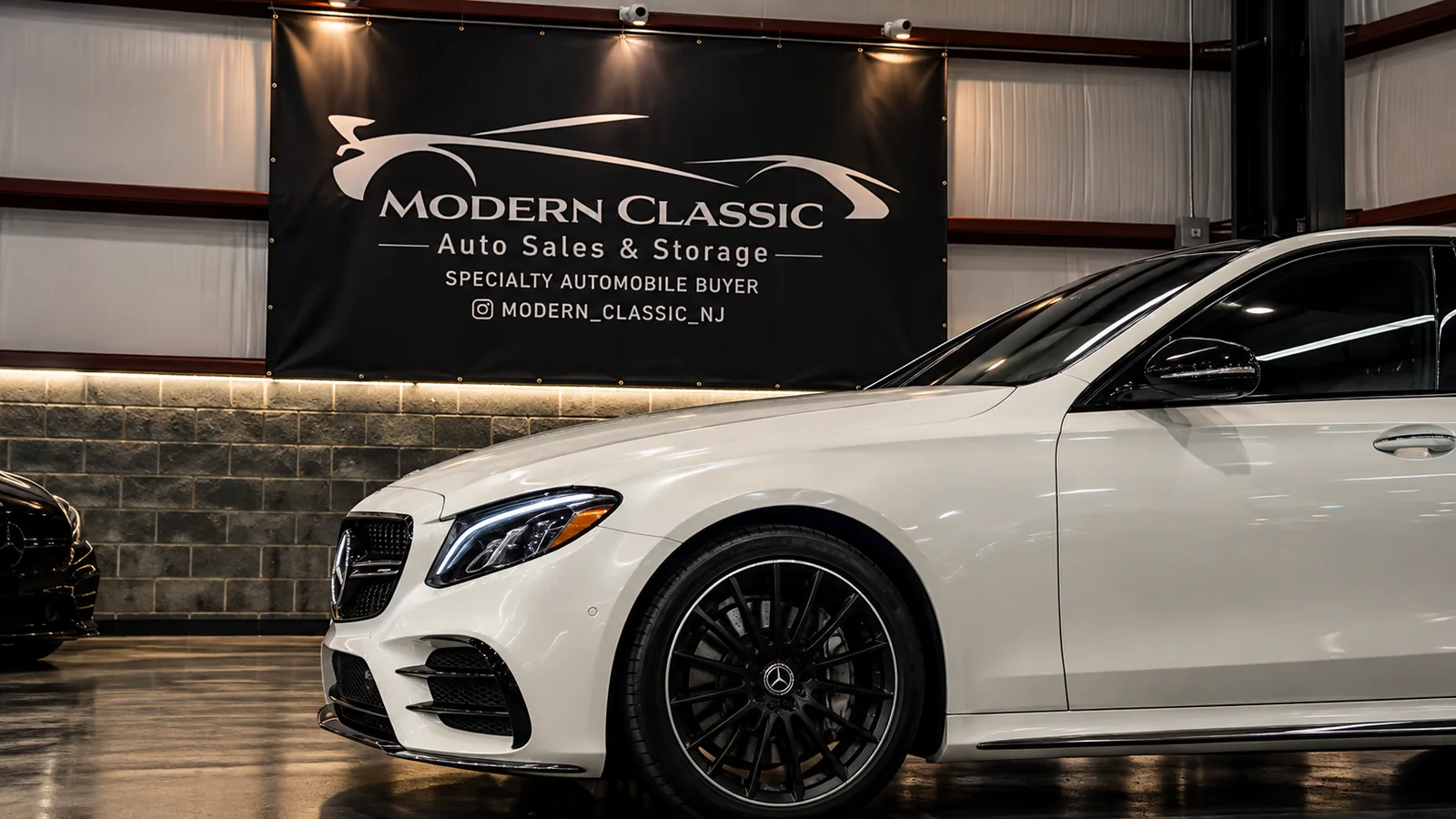 White Mercedes-Benz in the Modern Classic Auto Sales showroom